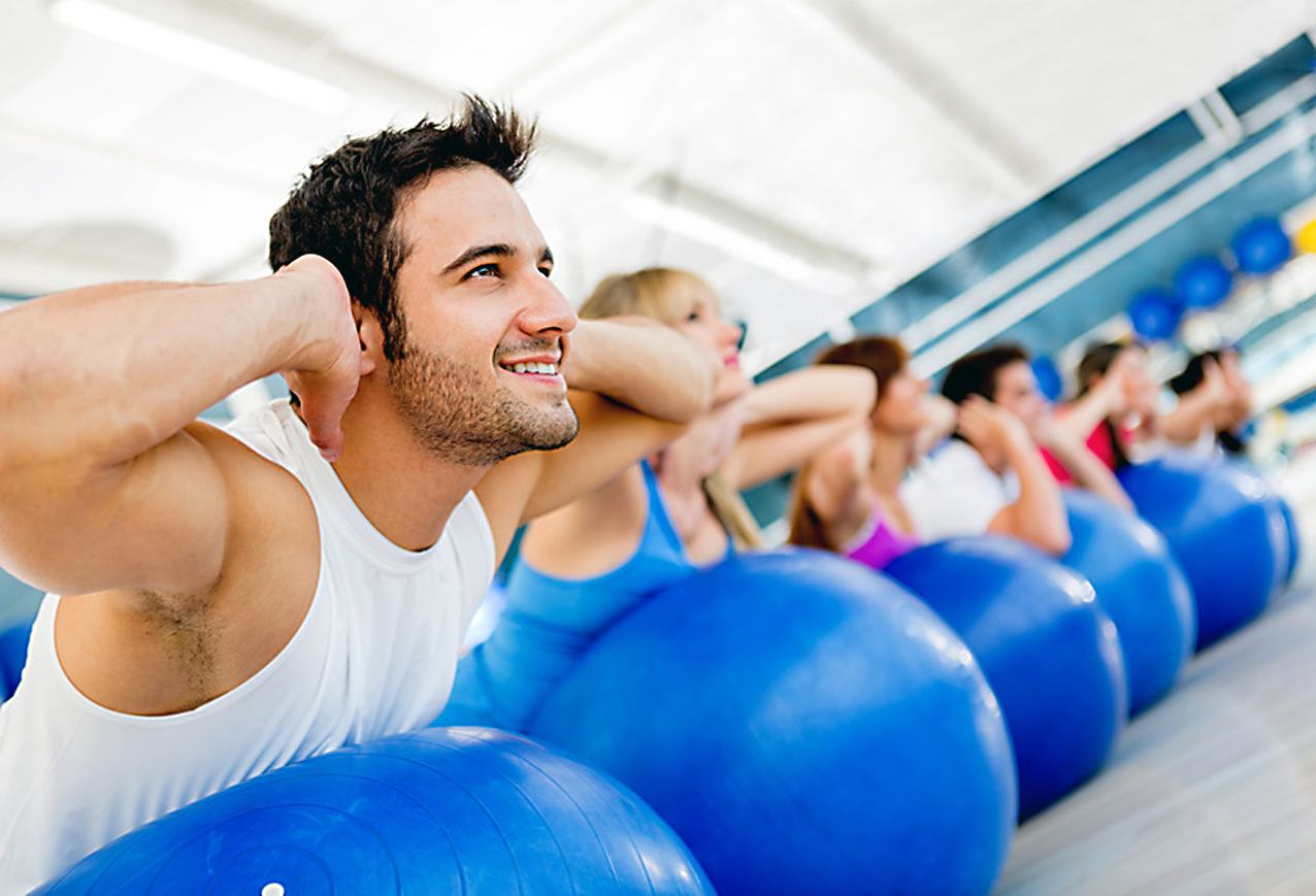 Group of people exercising at the gym in a fitness class